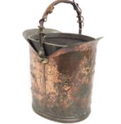 An arts & crafts leather lined copper bucket with