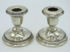A pair of 1921 Birmingham silver candle holders by