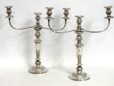 A pair of large antique three branch silver plate