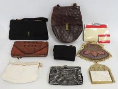 A selection of vintage handbags including one 1950s Bakelite style with matching purse in the manner
