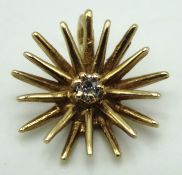A 9ct gold star shaped pendant set with small diam