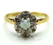 An 18ct gold ring set with opal & diamond, 2.9g, s