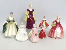 A collection of ornamental porcelain ladies compri