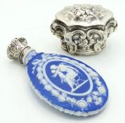 A white metal peppermint box with relief decor, te