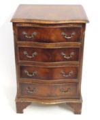 A mahogany serpentine fronted bedside chest of fou