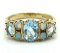 A 9ct gold ring set with topaz & opal, 3.3g, size