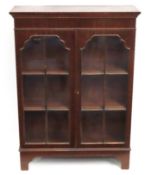 An early 20thC. mahogany glazed bookcase with two