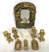 Four decorative golded cherub candle holders, a de