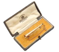 A c.1900 yellow metal hunting horn brooch in Mappin & Webb box, tests electronically as 15ct gold,