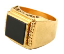 An 18ct gold gents "pinky" signet ring set with onyx within decorative mount, indistinct mark,