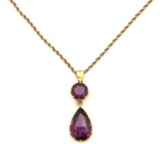 A 9ct gold rope chain with yellow metal mounted colour change stones, possibly alexandrite, tests
