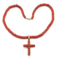 A Victorian coral necklace with cross with yellow metal fittings that test electronically as 15ct