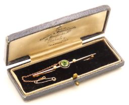 An Edwardian 15ct two colour gold bar brooch set with peridot & pearl in an Appleton of Burnley box,