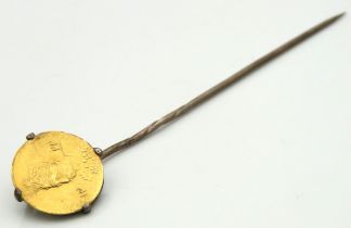 An antique tie pin set with Persian style coin, coin tests as 18ct gold, 69mm long, 1.5g