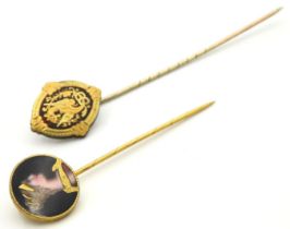 A 19thC. enamelled gilt tie pin, 15mm diameter, twinned with one other with gilded snake & dragon