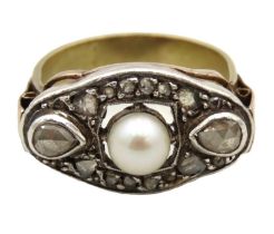 A substantial 1920s art deco yellow metal ring set with pearl & diamond, tests electronically as