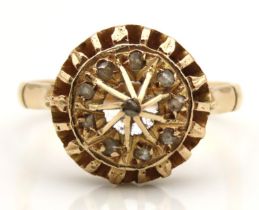A late Victorian/Edwardian ring set with rose cut diamonds, tests electronically as 14ct gold, 3.7g,