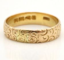 A late 19thC. Victorian 18ct gold Chester gold band with chased decor by the Coley Bros. 4.8g,