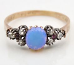 A Victorian yellow metal ring set with opal, ruby & rose cut diamonds, tests electronically as 15ct,