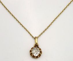 A yellow metal chain & pendant set with approx. 0.75ct of old cut diamond, tests electronically as