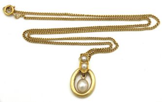 A yellow metal chain with antique pearl set pendant, 400mm long chain tests electronically as 18ct