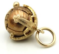 An antique yellow metal Masonic orb cross charm pendant, tests electronically as 9ct gold, 33mm
