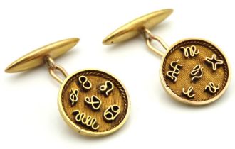 A pair of gents 18ct gold cufflinks bearing the twelve astrological signs of the Zodiac, head 14.