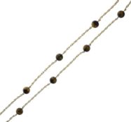 Tiger's eye and yellow metal necklace