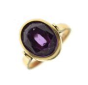 Synethetic colour change sapphire yellow metal ring