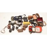Collection of vintage cameras and camera equipment