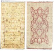 Two Indian wool rugs, retailed by Grutman