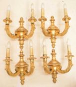 Set of four giltwood two branch wall sconces