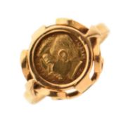 Yellow metal signet ring inset a JFK token