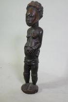African carved wood figure of a woman carrying a child, 62cm high