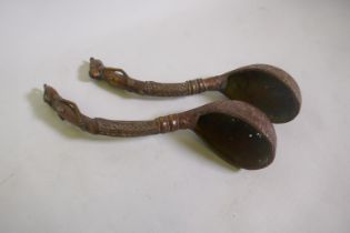 Two African copper and brass ladles with figural handles, 39cm long