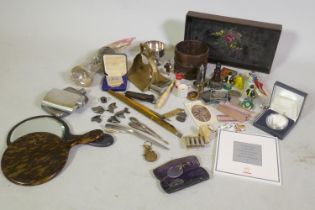 Quantity of collectables, an antique cast iron pot, brass stirrup, Queen Elizabeth II mementos, etc