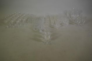 A suite of crystal drinking glasses, two patterns, and others