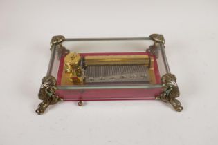 A vintage Reuge Sainte Croix Swiss music box with glass case, playing Antonio Vivaldi's Four Seasons