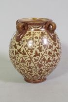 Hispano Moresque jar with four lug handles and lustre glaze, signed to base, 19cm high