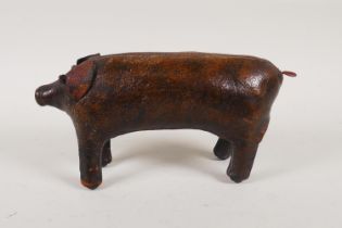 A vintage liberty style leather pig door stop in the manner of Dimitri Omersa, 24cm long