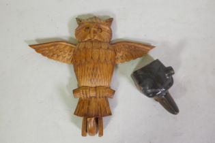 A Black Forest carved wood wall hook in the form of an owl, 27cm long, and an inkwell in the form of