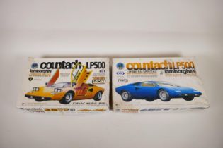 Two vintage 1970s Tokyo Marui Lamborghini Countach LP500 1/24 scale motorised plastic model kits