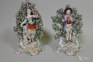 Two late C18th/early C19th soft paste porcelain bocage figures, possibly Derby, of a young woman