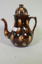 A C19th drip glazed tea/coffee pot, 27cm high