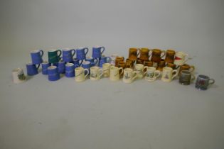 Collection of Wade 'Dee-Cee' souvenir miniature tankards/mugs including veteran cars and blue West