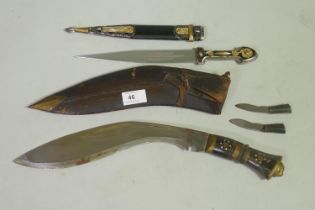 A Kukuri knife with leather sheath fitted with two smaller knives, 41cm long, and a dagger with