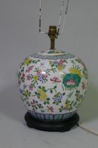 Chinese famille verte jar and cover with fruit and floral decoration converted to a lamp with wooden