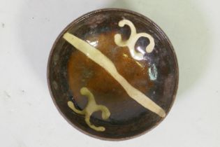 Antique earthenware slipware bowl with cream coloured decoration on a rich brown glaze, 14cm