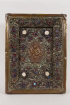 A Nepalese bronze filigree votive plaque of Vishnu, set with shell shards and semi precious