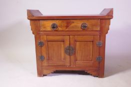 An oriental hardwood low side cabinet with single drawer over two cupboards, 70 x 35 x 61cm